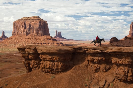 A Navajo rider at John Ford’s Point, facing the buttes of Monument Valley.