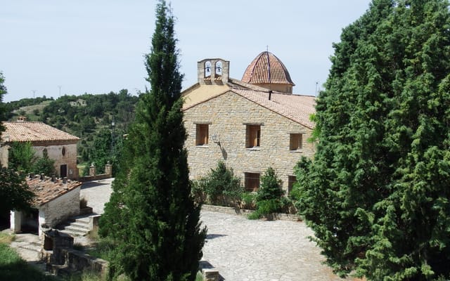 The San Bartolomé hermitage, at the bottom of the canyon: twelve Romanesque arches and a rose window long said to be Templar.